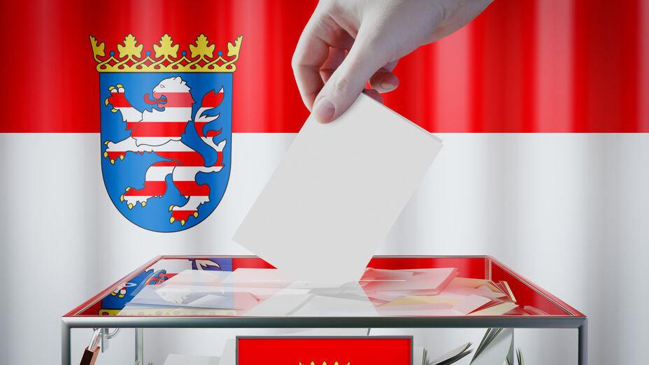 Hesse flag, hand dropping ballot card into a box - voting/ elect